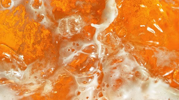 Super Slow Motion Shot of Rippling Fresh Beer Wave From Top Shot at 1000Fps