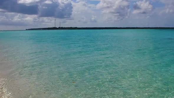 Summer travel of coastline beach trip by blue water with sand background near surf