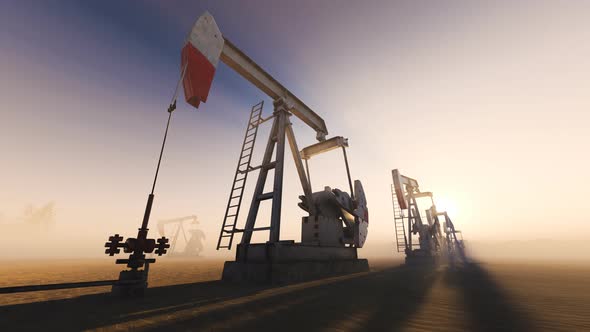 Loopable shot of oil pumps pumping oil on a field with god rays. Oil industry 4K