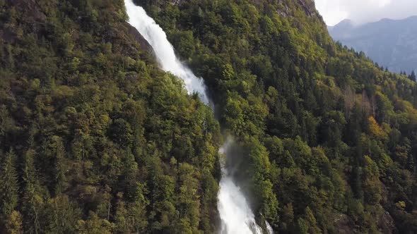 A Long Waterfall In The Middle Of The Woods Taken