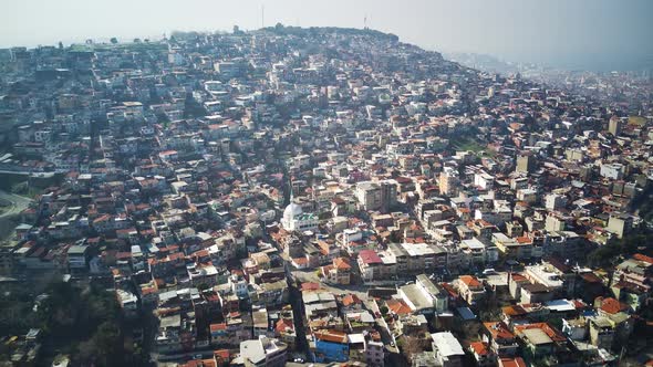 Drone view on poverty slum district and muslim mosque