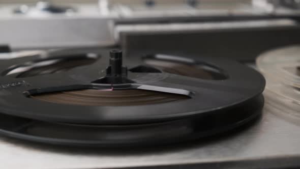 Extreme Close Up Shot of Spinning Reels on Old Analogue Reeltoreel Audio Tape Recorder