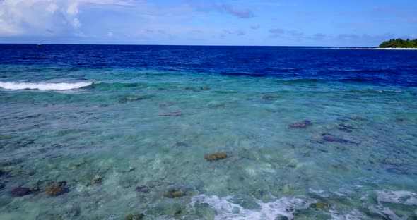 Beautiful above abstract view of a white sand paradise beach and aqua blue ocean background in color