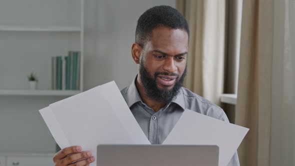 Tired Annoyed Angry Bearded African Businessman Office Clerk Searching Information in Documents