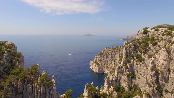 Aerial travel drone view of clear green water, cliffs of Cassis, Mediterranean Sea, Southern France.