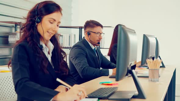 Business People Wearing Headset Working in Office