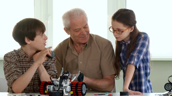 Little Girl Joins Her Brother and Granpa