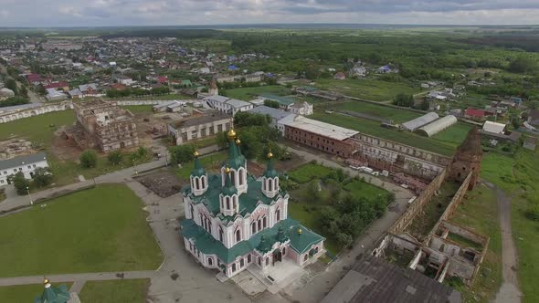 Aerial view monastery surrounded by a brick wall on the edge of the Dalmatovo city. 20