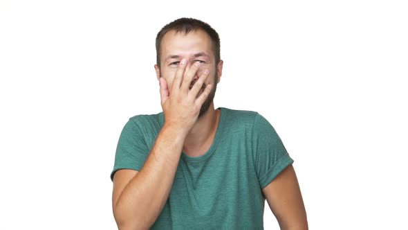 Headshot Portrait of Bearded Hilarious Man 30s Giggling Laughing Touching His Face Expressing It's