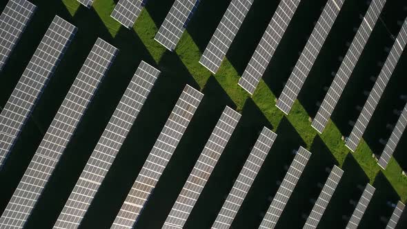 Aerial Top View of Solar Farm with Sunlight Cells for Producing Renewable Electricity