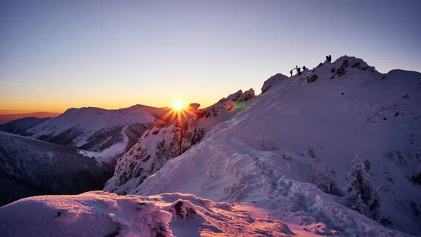 Sunset From the Top of a Snowy Mountain