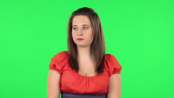 Portrait of Cute Girl Is Scared, Then Smiles and Sighs in Relief. Green Screen