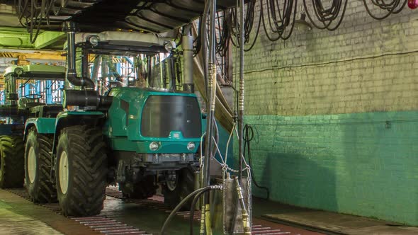 Conveyor Assembly Stage the Body of Tractor at Big Industrial Factory Timelapse