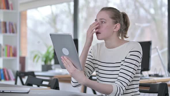 Failure Young Woman with Loss on Tablet in Library