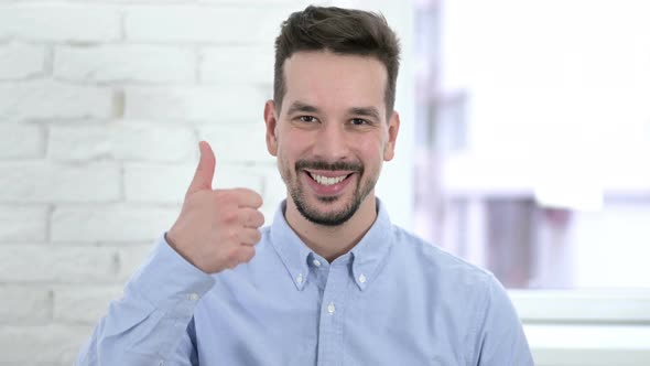 Portrait of Creative Man Showing Thumbs Up