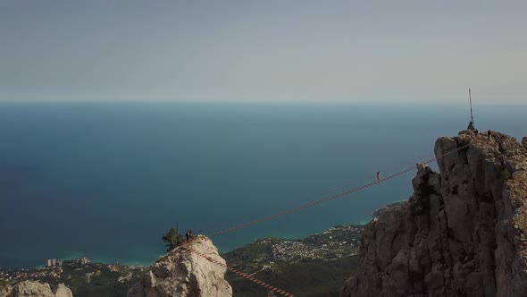 The Famous Highest Mountain of Crimea - Ai-petri Aerial View, Yalta. Tourists Climb on an Extreme