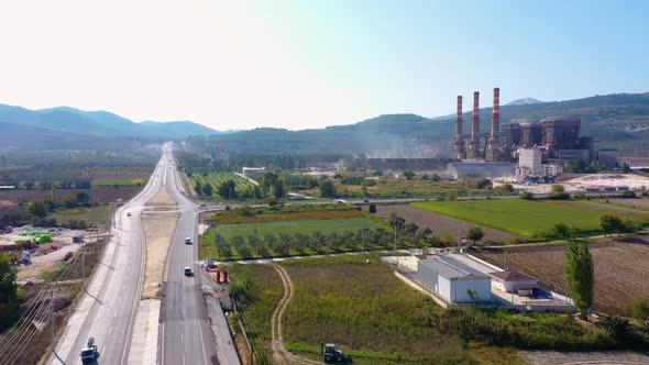 Aerial View of Country Road Along Agricultural Fields