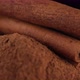 Cinnamon sticks and cinnamon powder isolated on black background, sliding shot - VideoHive Item for Sale