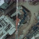 Construction Crane on a Construction site - Aerial footage - VideoHive Item for Sale