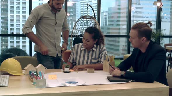 Creative Business People Group Having Conversation at Office Desk in Workplace