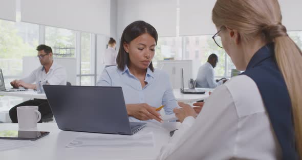 View Over Shoulder of Caucasian Female Applicant Having Job Interview of African Woman Hr Manager