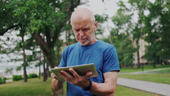 Elder Senior Using Wireless Tablet PC