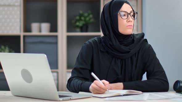 Confident Modern Young Muslim Woman Studying Distance e Learning Education at Home Workplace
