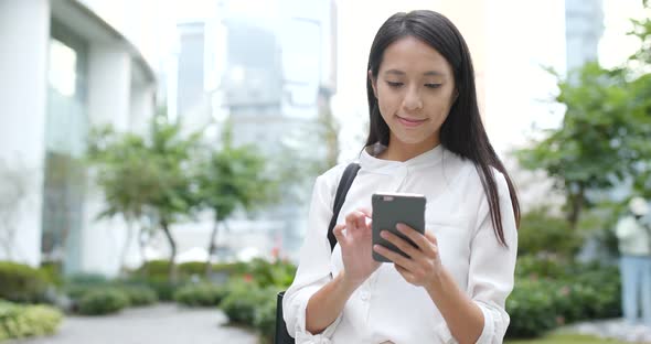 Young Woman use of mobile phone in city