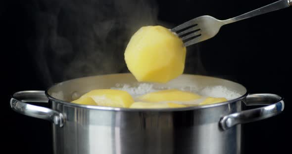 Welded in the Pan the Potatoes on a Fork. 