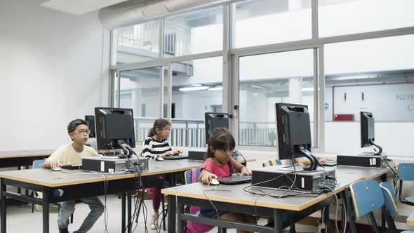 Multiethnic Focused Children Learning Computer Science