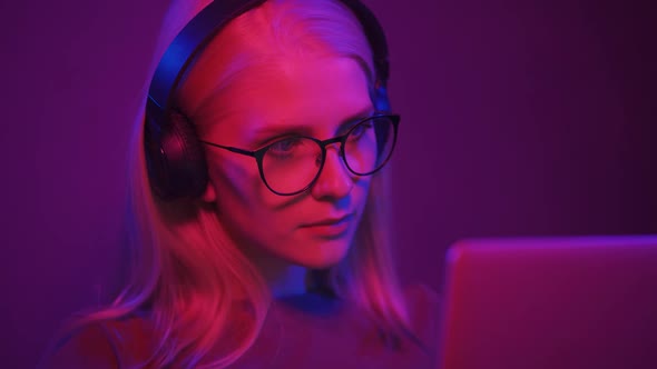 Portrait of a Young Female Gamer at the Computer Club