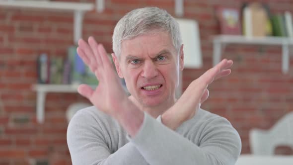Senior Old Man Saying No with Hand Gesture 