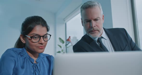 Multi racial staff members of international company working together