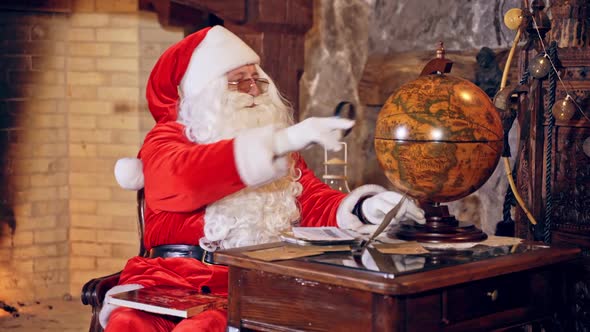 Santa with a globe