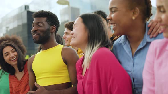 Diverse happy young people having fun laughing together outdoor - Diversity community concept