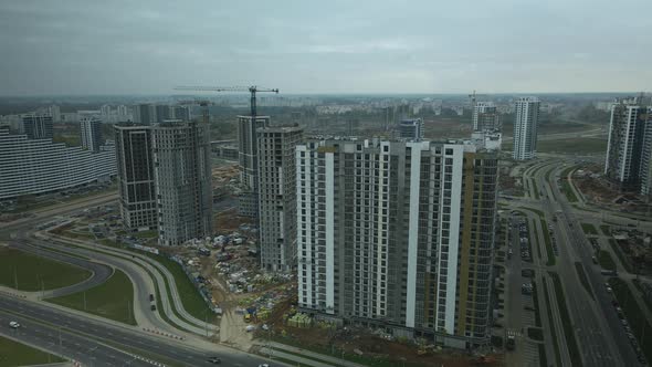 Construction of modern multi-storey buildings. Construction of a new city block.