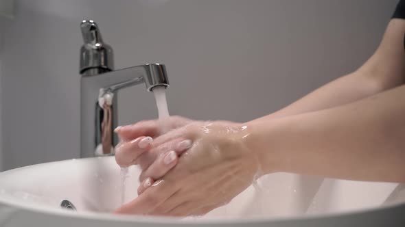Woman Washes Her Hands