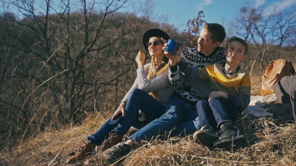 A Happy Young Family Having a Good Time Outdoors on a Sunny Spring Day