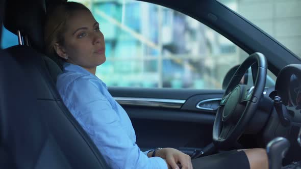 Upset Woman Tired After Working Day, Sitting in Car, Thinking Over Problems