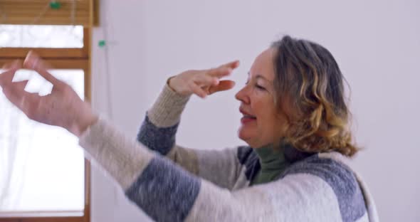 an Elderly Woman and Her Husband Dance at Home