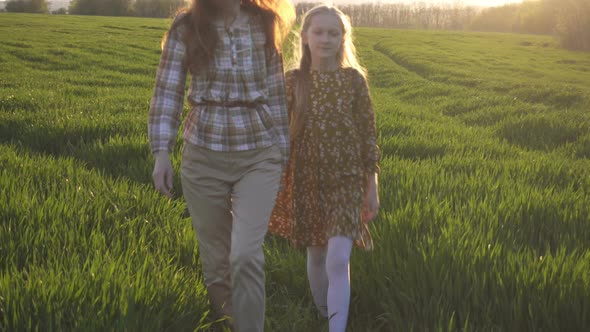 Mother And Daughter Standing In The  Field 3