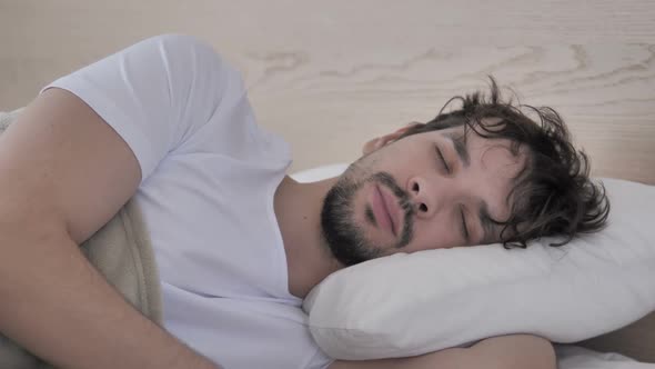 Restless Man Having Headache While Sleeping on Side in Bed