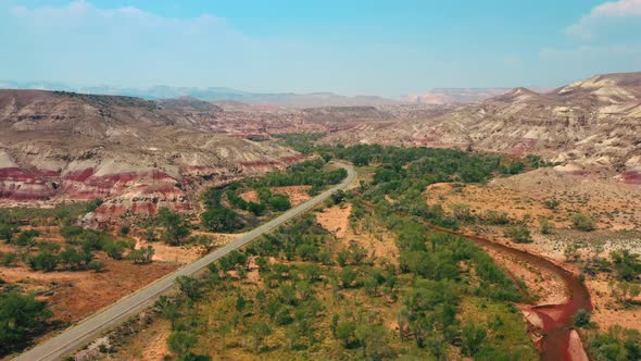 Road View To Bentonite Hills Near Hanksville, Utah, USA. - Drone Tilted Down