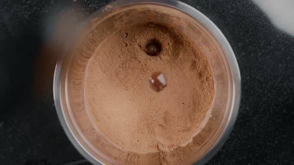 Tabletop Shot: Chef Chocolatier Drops Truffles To the Cocoa Powder in Slow Motion, Confectioner