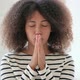 Hopeful African Woman Praying with Hands Crossed - VideoHive Item for Sale