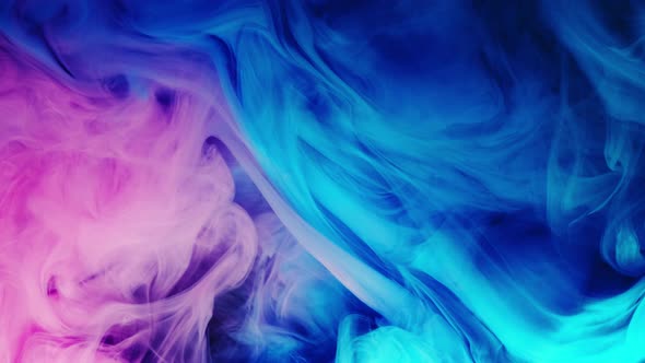 Colorful Puffy Puffs of Smoke on an Isolated Black Background, Modern Colorful Blue Purple Light