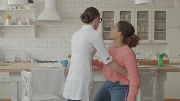 Nutritionist Measuring Patient's Waist During Consultation