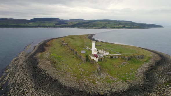 The Island of Pladda off the South Coast of Arran in Scotland with a Lighthouse