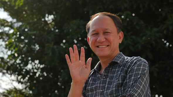 Close Up Of Happy Asian Old Man With Nature Background