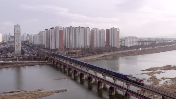 Aerial View Of Train Transportation Cross The Bridge